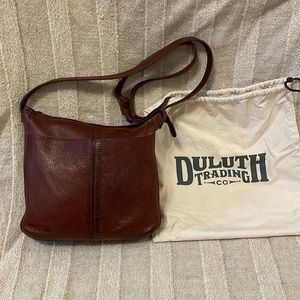 Duluth trading co. Genuine leather purse with dust bag. Adjustable strap